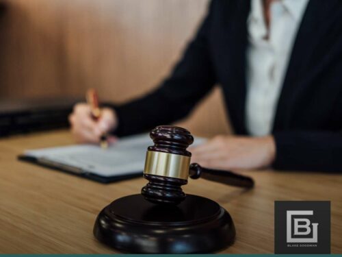 Lawyer reviewing documents related to Chapter 7 bankruptcy case with a gavel in the foreground